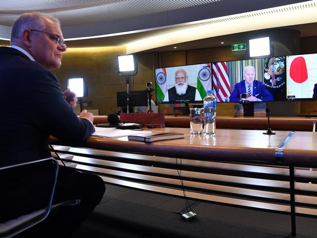 The Prime Minister of Australia Scott Morrison (left) is seen participating in the inaugural Quad leaders meeting with the President of the United States Joe Biden, the Prime Minister of Japan Yoshihide Suga and the Prime Minister of India Narendra Modi during a virtual meeting in Sydney, Friday, March 12, 2021. (AAP Image/Pool/Dean Lewins) NO ARCHIVING