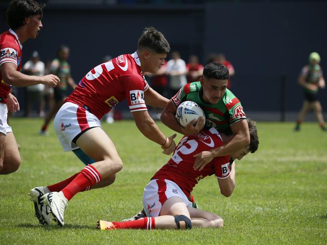 James Davies is wrapped up by the Steelers defence. Photo: Warren Gannon Photography