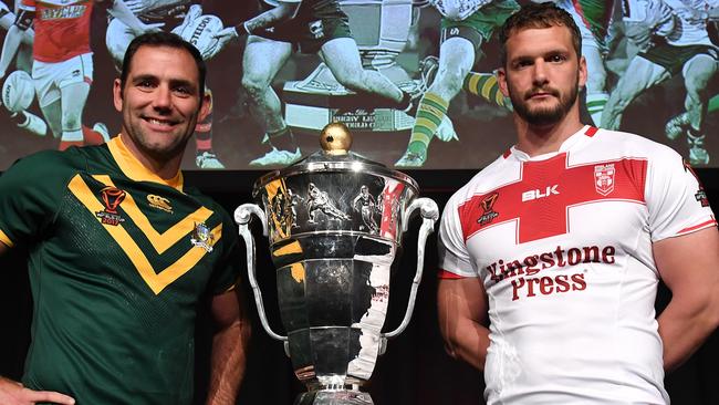 Australia's Rugby League World Cup captain Cameron Smith (left) and England's Sean O'Loughlin pose for a photo with the trophy during a media event in Brisbane, Sunday, October 22, 2017. The Rugby League World Cup kicks off on Friday in Melbourne with Australia playing against England.