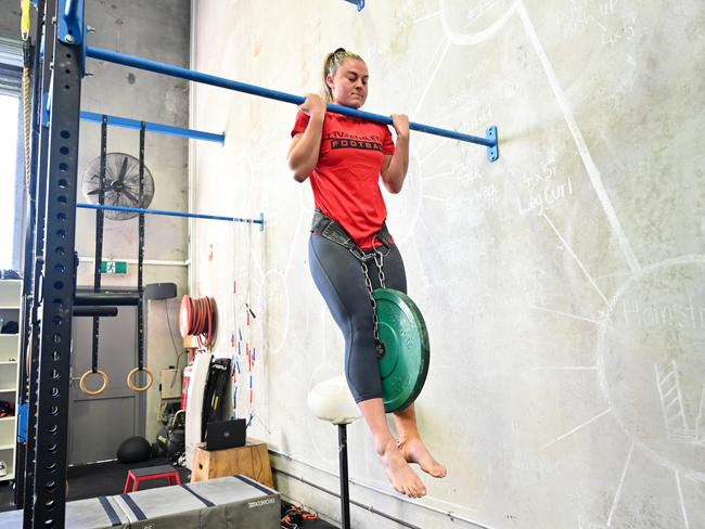 Georgia Page (Dragons) working on the chin-up bar. Picture: Grant Trouville