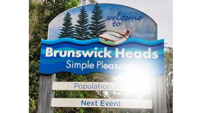 The entry signage into Brunswick Heads was defaced with a rude message. Picture: Facebook