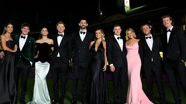 Errol Gulden and partner Grace Scott; Brodie Grundy with fiancee Rachael Wertheim; Callum Mills with fiancee Tiffany Browne; Chad Warner and partner Alice Hughes and Nick Blakey and James Rowbottom at the Sydney Swans 2024 Brownlow Medal function. Picture: Getty Images)