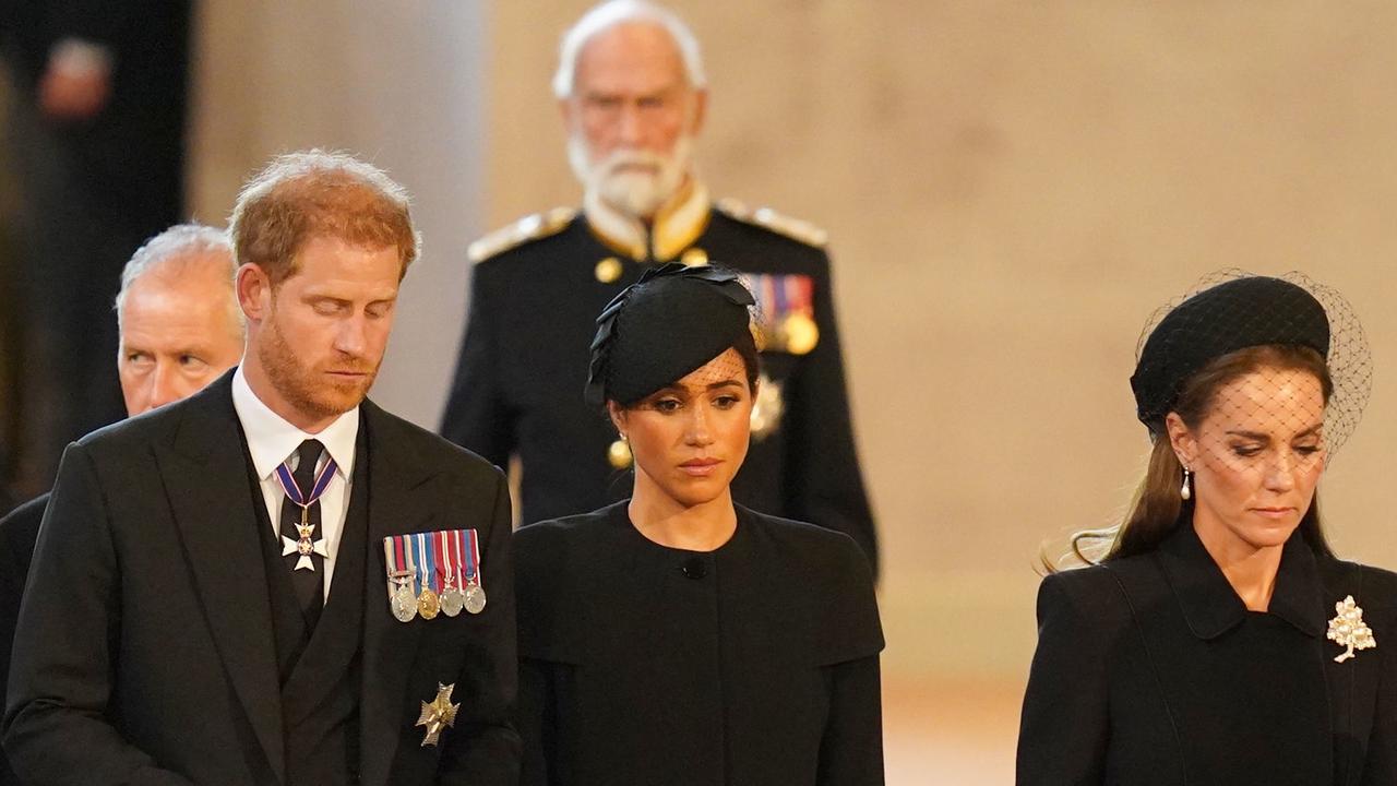 Prince Harry, wife Meghan and Catherine, Princess of Wales stand at the coffin of Queen Elizabeth II. Picture: Jacob King – Pool/Getty Images