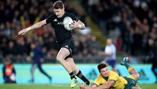 Beauden Barrett of the All Blacks breaks the Wallabies defence to score his third try.