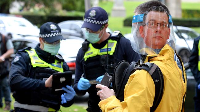 An anti-lockdown protestor wearing a Daniel Andrews mask near the Shrine of Remembrance. Picture: Andrew Henshaw