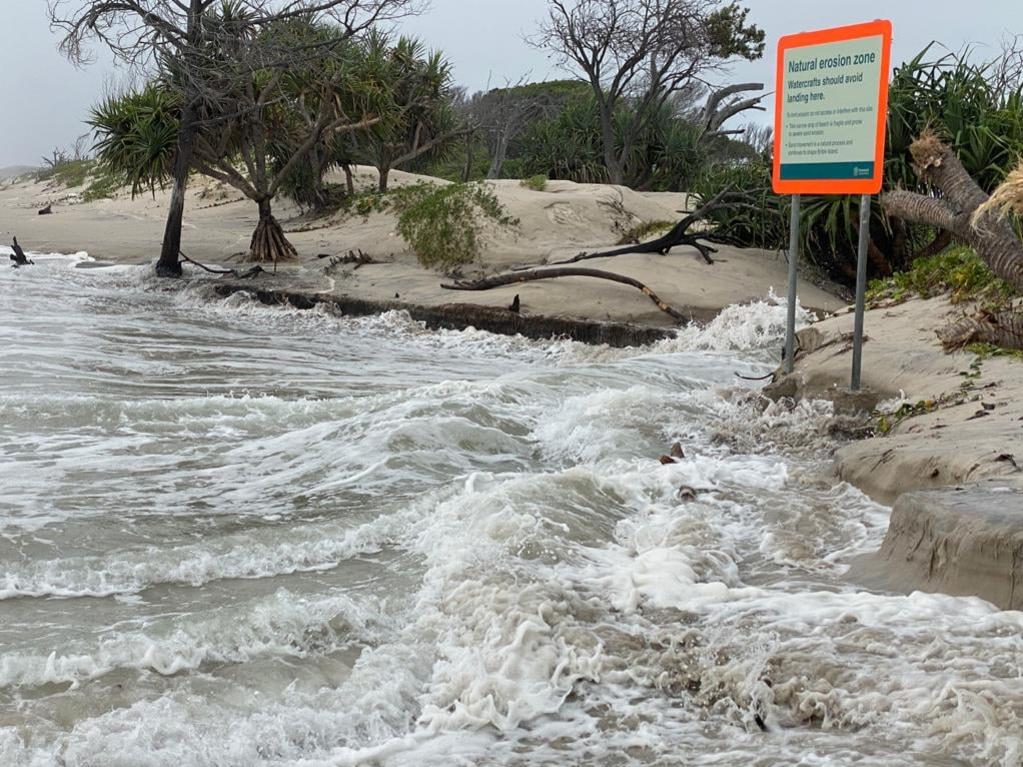 A king tide and huge swells combined to break through part of Bribie Island, creating a second bar into the Pumicestone Passage.