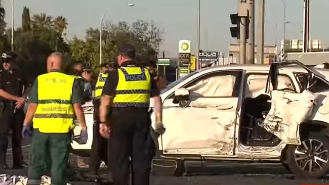 Emergency services with the car involved in the crash. Picture: 7NEWS