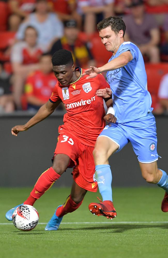 Adelaide United’s Al Hassan Toure was too slick for the likes of City’s Curtis Good in the FFA Cup final. Picture: Getty Images