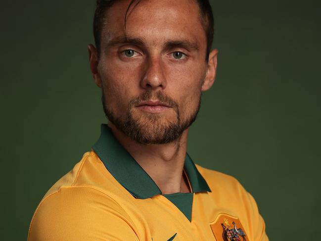 SYDNEY, AUSTRALIA - MAY 20: James Holland of the Socceroos poses during an Australian Socceroos portrait session at Crowne Plaza Terrigal on May 20, 2014 in Sydney, Australia. (Photo by Cameron Spencer/Getty Images)