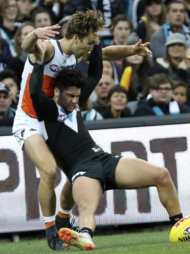 Chad Wingard crashes back into Matt Buntine. Picture Sarah Reed