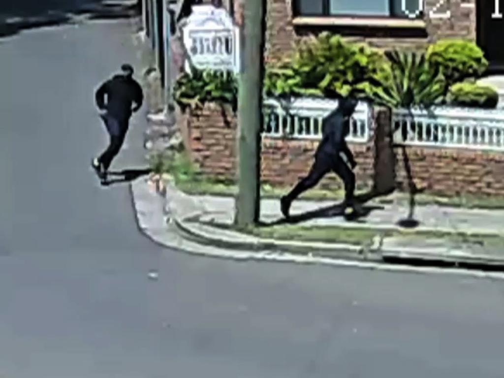 Still image supplied by NSW Police of 2 men suspected of being the shooters of Mahmoud "Mick" Hawi running from the Rockdale scene.