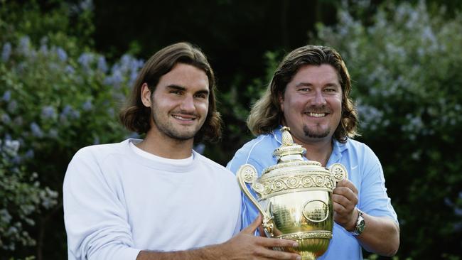 Federer and Lundgren with the Wimbledon trophy. Photo by Phil Cole/Getty Images