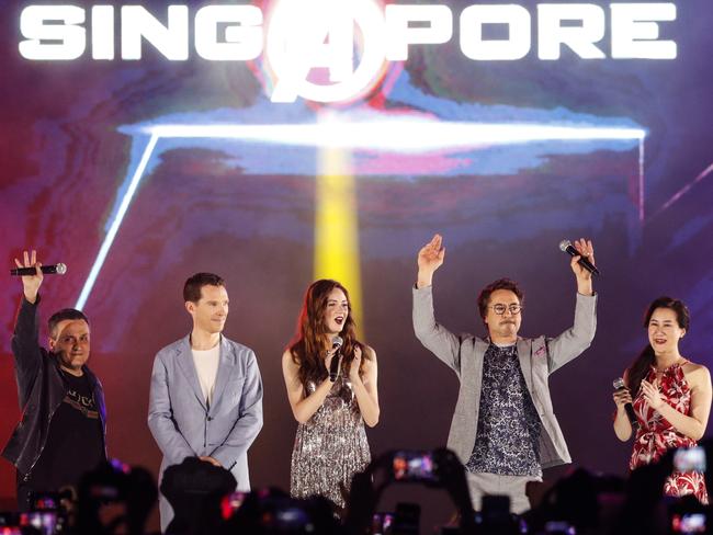 Robert Downey Jr (second from right) waves to his cheering fans at a red carpet event in Singapore last week to launch Avengers: Infinity War. Downey was joined by (from left) co-director Joe Russo, actors Benedict Cumberbatch and Karen Gillan, and executive producer Trinh Tran. Picture: AP Photo/Yong Teck Lim