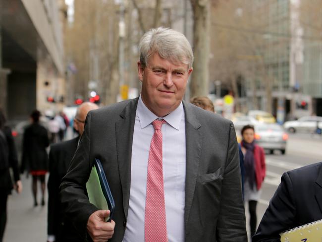 Nicholas Sampson, former headmaster of Geelong Grammar and current head of Cranbrook in Sydney, leaves the County Court in Melbourne during the child abuse Royal Commission hearing.