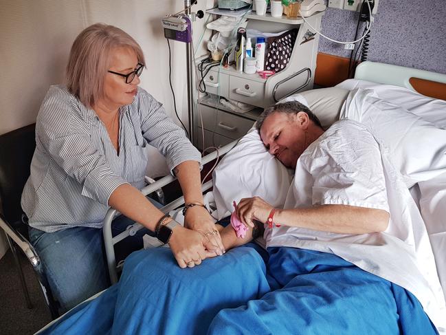 Colleen Mitchell at her husband Wayne’s hospital bedside. Picture: Sam Ruttyn