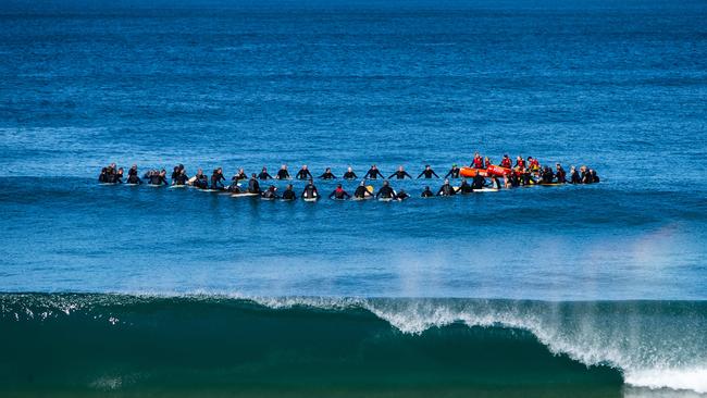 Surfers taking part in the paddle-out to honour Damien Lovelock. Picture: (AAP Image / Julian Andrews).