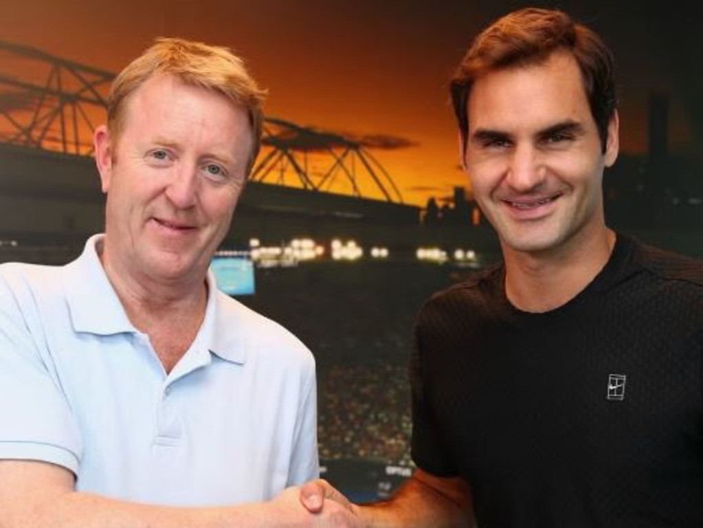 British tennis writer Mike Dickson, with Roger Federer, has died in Melbourne at the age of 59. Picture: Supplied