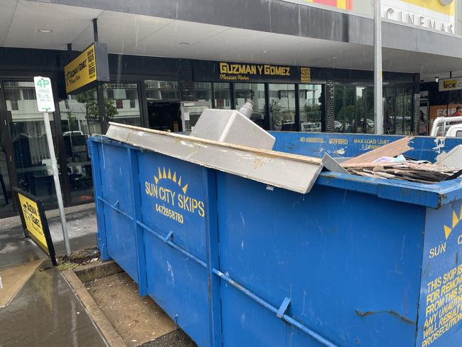 The Guzman y Gomez store in the Townsville CBD was being stripped and dumped into two skip bins on Tuesday. Picture: Leighton Smith.