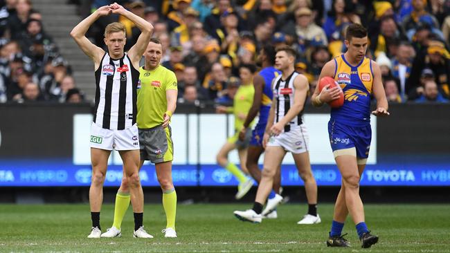 Jaidyn Stephenson and Elliot Yeo in the moments after the Adams kick. Picture: AAP Images