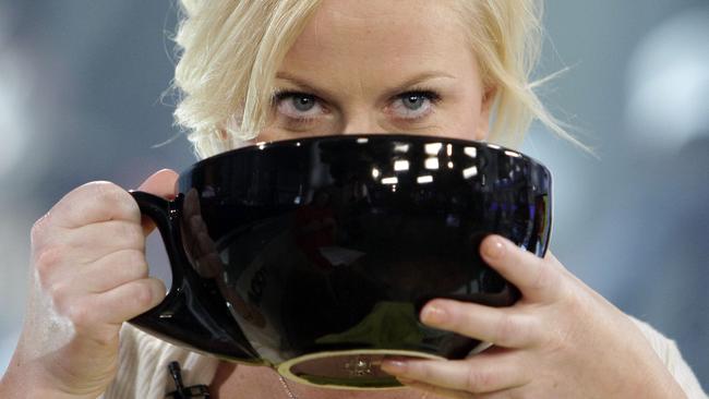 Actress Amy Poehler sips from a giant coffee cup during her appearance on the NBC 'Today' television program in New York Thursday, April 23, 2009. (AP Photo/Richard Drew)
