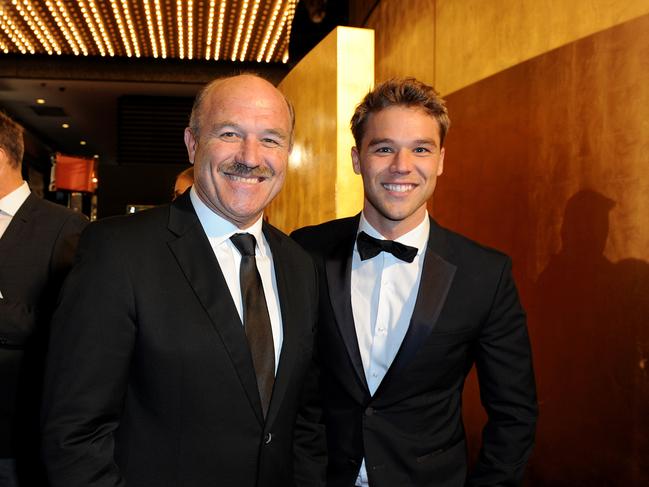 Lincoln Lewis (right) and with his dad, legendary NRL player Wally Lewis at The Logie Awards in 2014. Picture: AAP Image/Joe Castro