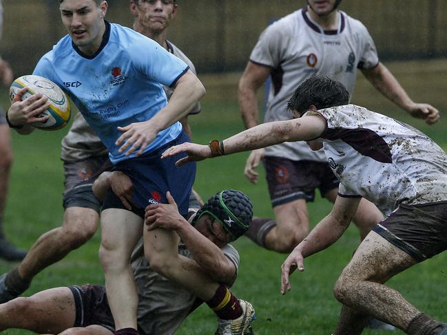 NSW's Jay Ingleton with the ball. Queensland 2  (white and Maroon)   v NSW 1 (2 tone blue) . action from Game. 48th Australian School Rugby Championships at Knox Grammar. Picture: John Appleyard