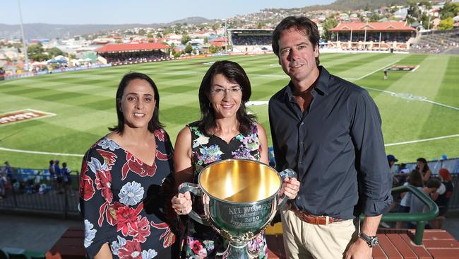 AFLW chief executive Nicole Livingstone, left, Tasmanian Minister for Sport and Recreation, Jacqui Petrusma, and AFL chief executive Gillon McLachlan holding the AFLW premiership cup at the match between North Melbourne and Carlton at North Hobart Oval yesterday. Picture: LUKE BOWDEN