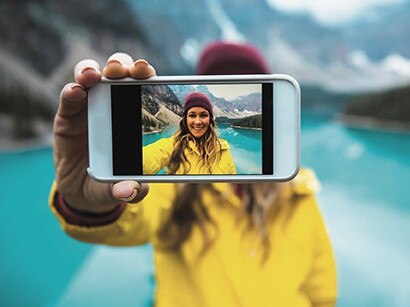 People often take selfies to show others their travels or the highlights of their life.