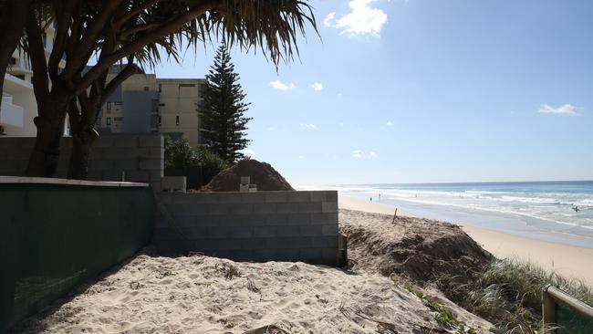 A masonry block wall extends from a mansion that's been built on northern beachside of Woodroffe Ave, effectively finishing the oceanway. Picture Glenn Hampson