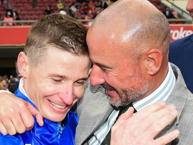 MELBOURNE, AUSTRALIA - OCTOBER 22: James McDonald is congratulated by Glen Boss after riding Anamoe to win Race 9, the Ladbrokes Cox Plate,  during Cox Plate Day at Moonee Valley Racecourse on October 22, 2022 in Melbourne, Australia. (Photo by Vince Caligiuri/Getty Images)