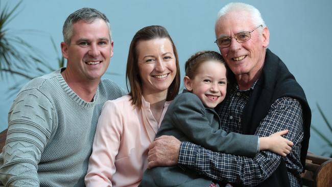 Lucy Stares, 7, raised $940 from family and friends. She’s pictured with dad Daniel, mum Kate and grandad Trevor Turner. Picture: Robert Pozo