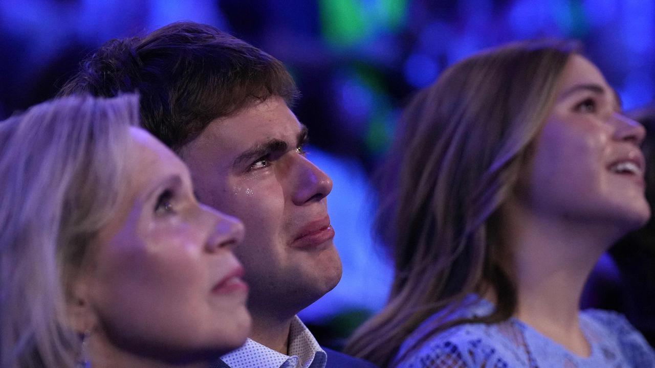 Minnesota first lady Gwen Walz and her children Gus Walz and Hope Walz look on as Tim Walz speaks. (Photo by Andrew Harnik / GETTY IMAGES NORTH AMERICA / Getty Images via AFP)