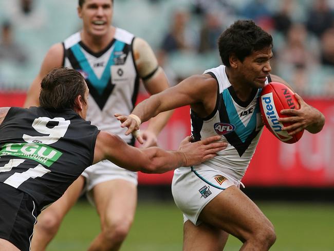 Jesse White is unable to lay a tackle on Port Adelaide speedster Jake Neade. Picture: Wayne Ludbey