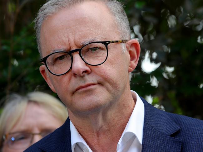 FEDERAL ELECTION TEAM 2022. LABOR BUS TOUR 18/4/2022 - Labor leader Anthony Albanese visits flood victims in Auchenflower, Brisbane on day 7 of the federal election campaign. Albo is accompanied by Shadow Treasurer Jim Chalmers, Labor candidate for Brisbane, Madonna Jarrett. Picture: Toby Zerna