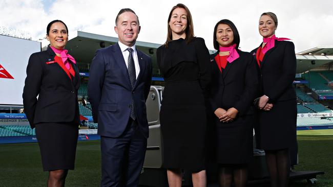 Qantas CEO Alan Joyce and Chief Executive of Qantas's loyalty business Olivia Wirth with some of Qantas's flight crew at the SCG. Picture: Adam Yip