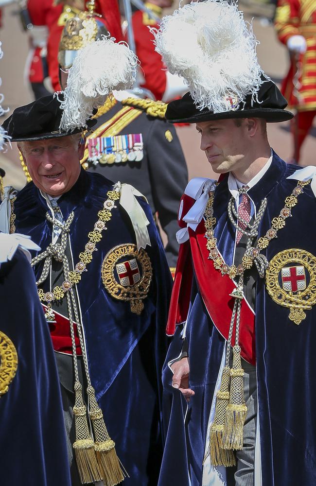 Prince Charles and Prince William in traditional velvet robes. Picture: Getty Images