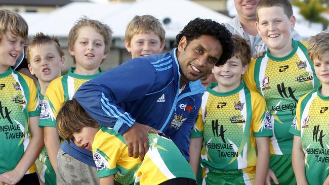 Preston Campbell's son Jayden Campbell who plays on the Under 11's Helensvale Hornets team will play their grand final game this weekend placed top of the ladder while the Titans will play their last game this weekend placed bottom of the ladder. Jayden tackles Preston while the team and coaches Lee Sharp and Paul Bonner look on.