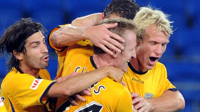 Gold Coast United players pictured during a 2010 match.(AAP Image/Dave Hunt)