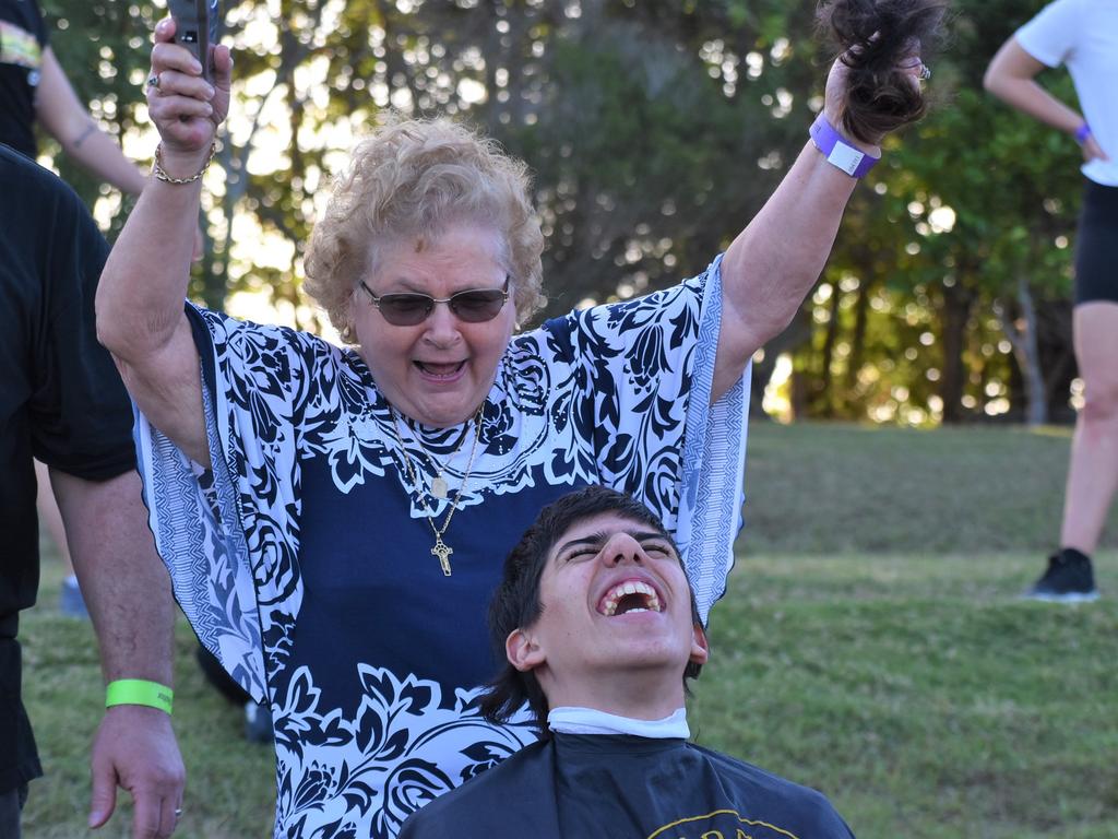 Great-grandmother Mary Vella made the first cut on her great-grandson Dean Grech's mullet at the Mackay Pioneer Valley Relay For Life, September 2021. Picture: Lillian Watkins