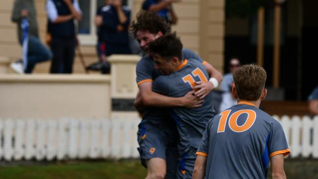 Levi Collins and Xavier Veivers Brown celebrate.