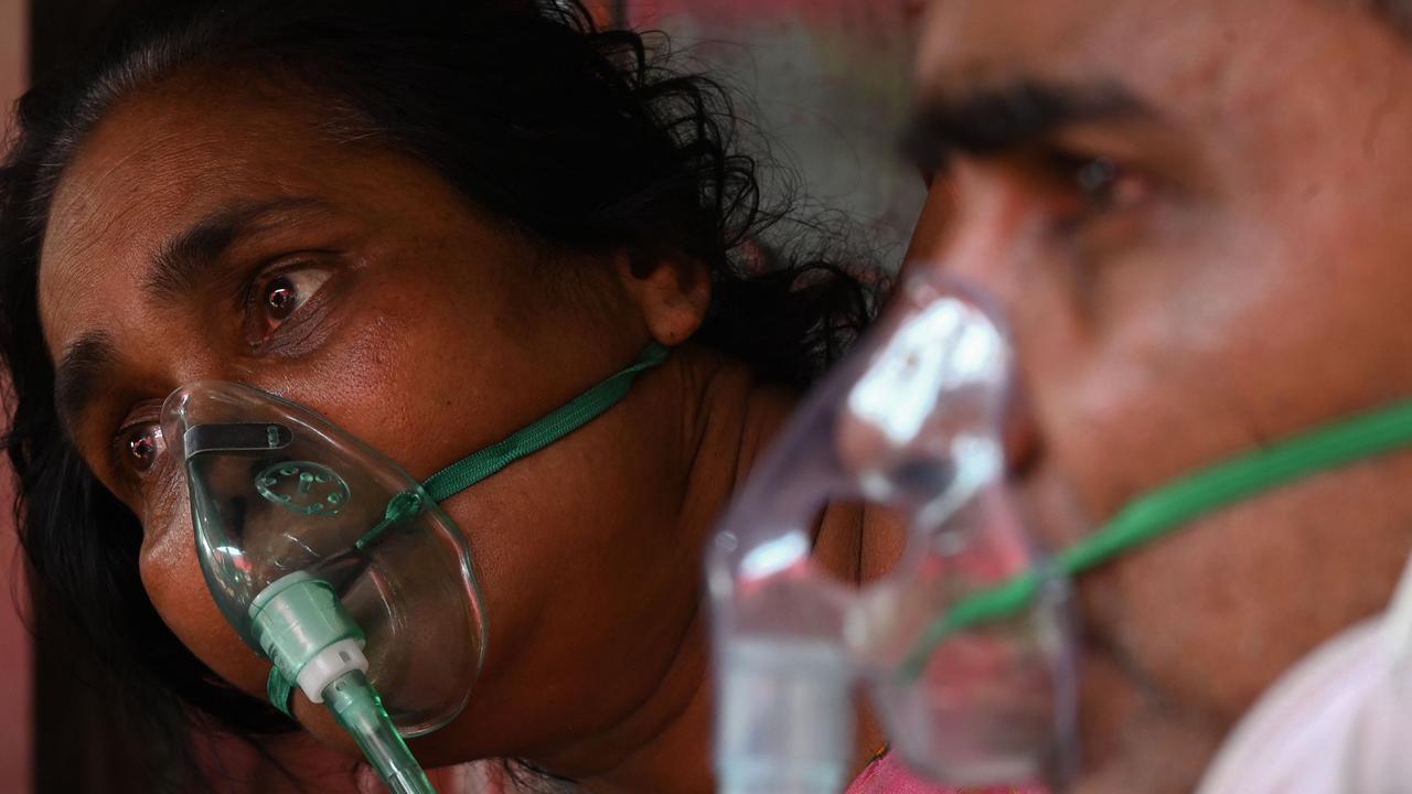 Patients breathe with the help of oxygen under a tent installed along the roadside in Ghaziabad. Picture: Sajjad Hussain/AFP