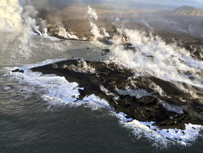 New land is formed by lava from Kilauea Volcano where the bay and village of Kapoho once stood on the island of Hawaii. Picture: U.S. Geological Survey via AP