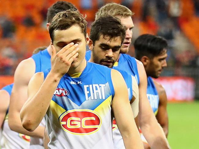 SYDNEY, AUSTRALIA - MAY 14: Suns players look dejected after losing the round eight AFL match between the Greater Western Sydney Giants and the Gold Coast Suns at Spotless Stadium on May 14, 2016 in Sydney, Australia. (Photo by Cameron Spencer/Getty Images)