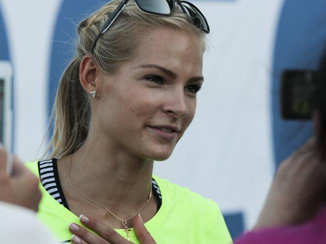 FILE - In this June 20, 2016 file photo, Russia's long jumper Darya Klishina speaks at the national track and field championship in Cheboksary, Russia. Klishina is the only athlete who met the standards when track's governing body, the IAAF, banned the Russian team from the 2016 Summer Olympics in June after an investigation revealed a culture of widespread, state-sponsored doping within the program. (AP Photo/Nikolai Alexandrov, File)