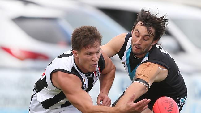 Sale star Shannen Lange battles for the ball with Wonthaggi’s Tim Knowles. Picture: Yuri Kouzmin