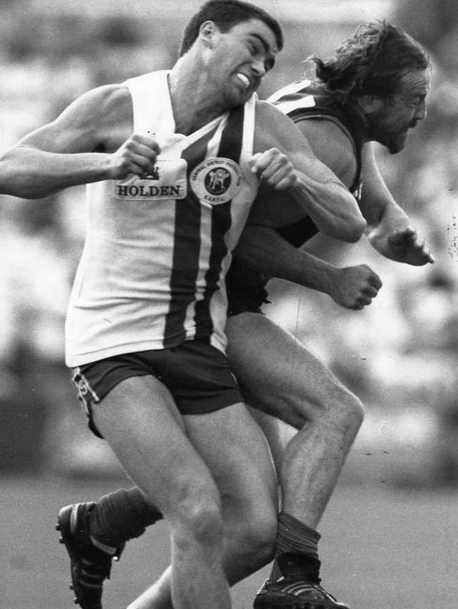 Norwood’s Garry McIntosh crunches Centrals player Brenton Sickerdick.