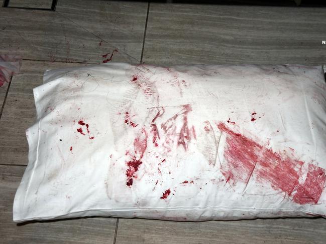 A bloodied pillow was left behind after one stay. Source: NSW Police,