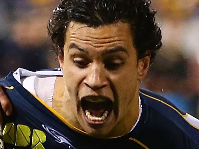 CANBERRA, AUSTRALIA - MAY 31: Matt Toomua of the Brumbies scores a try during the round 16 Super Rugby match between the Brumbies and the Rebels at Canberra Stadium on May 31, 2014 in Canberra, Australia. (Photo by Mark Nolan/Getty Images)