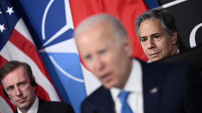 US President Joe Biden (C) flanked by Secretary of State Antony Blinken (R) and US National Security Advisor Jake Sullivan (L).