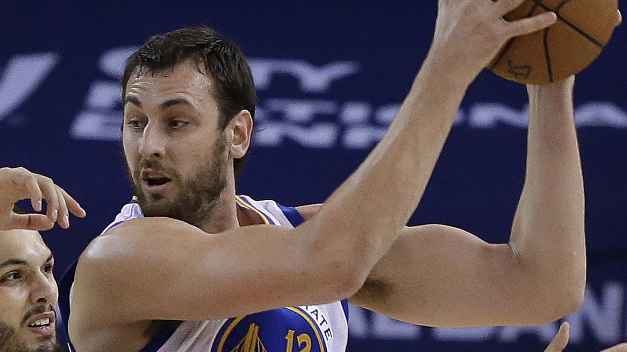 Golden State Warriors' Andrew Bogut, right, keeps the ball from Orlando Magic guard Evan Fournier (10) during the first half of an NBA basketball game Tuesday, Dec. 2, 2014, in Oakland, Calif. (AP Photo/Ben Margot)